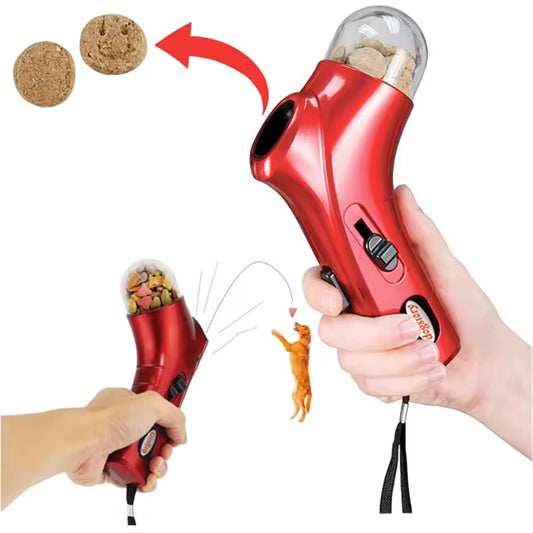 Red handheld device with a cat toy attachment, showing cork balls and a cat figure.